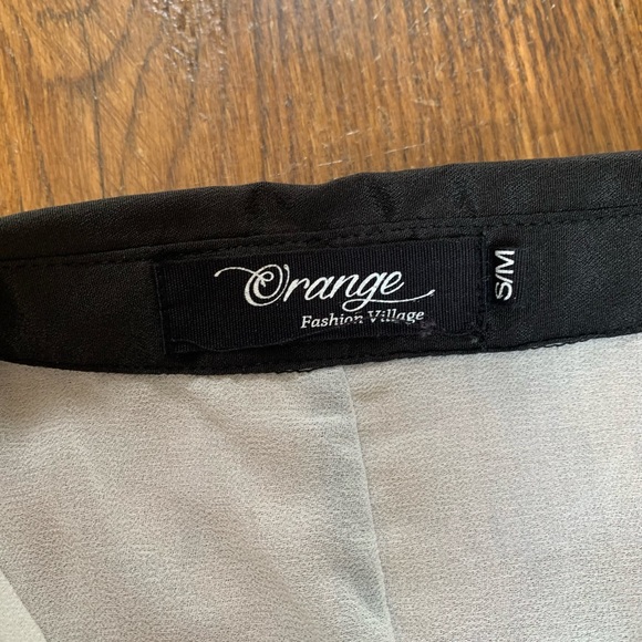 Long sheer sleeveless top. - Picture 2 of 3